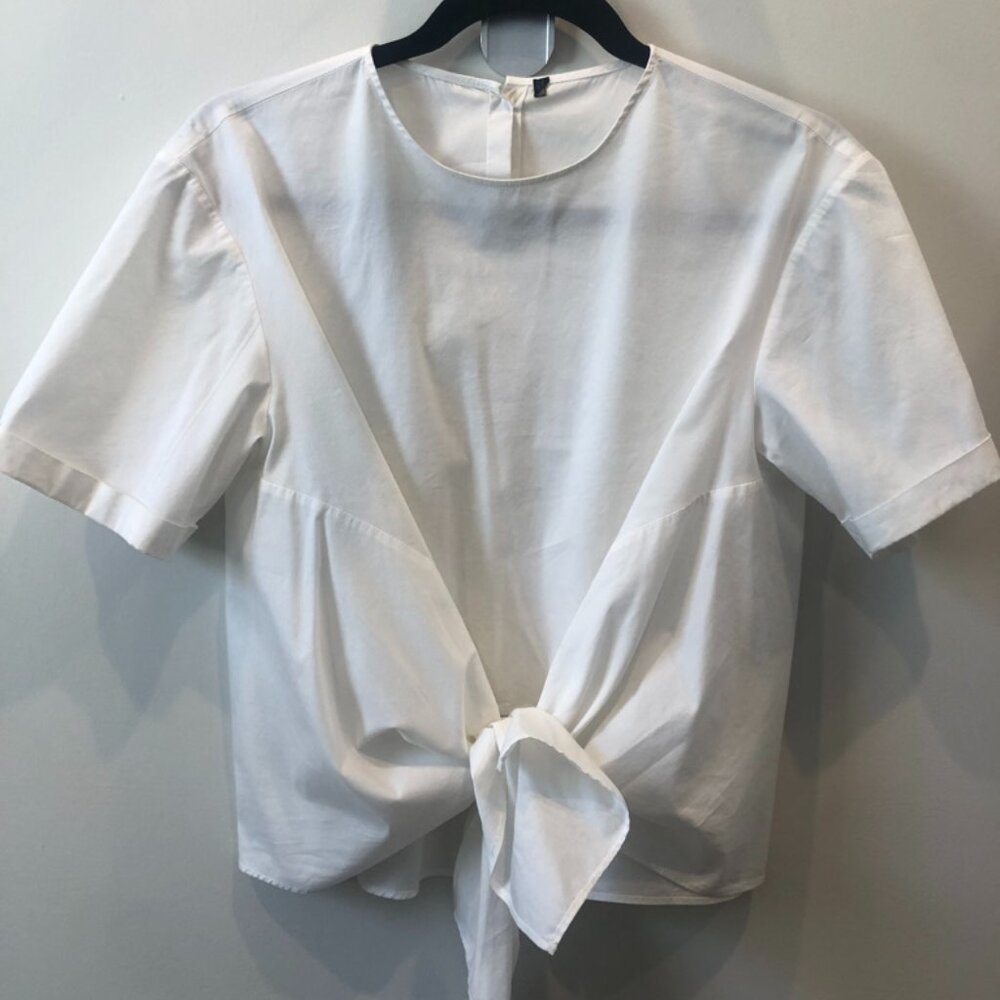White tie-front blouse with buttons in the back.